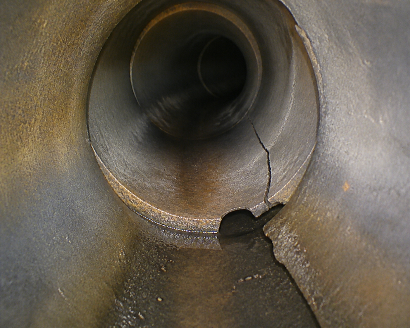 Inspection camera view of a cracked and broken sewer lateral pipe section